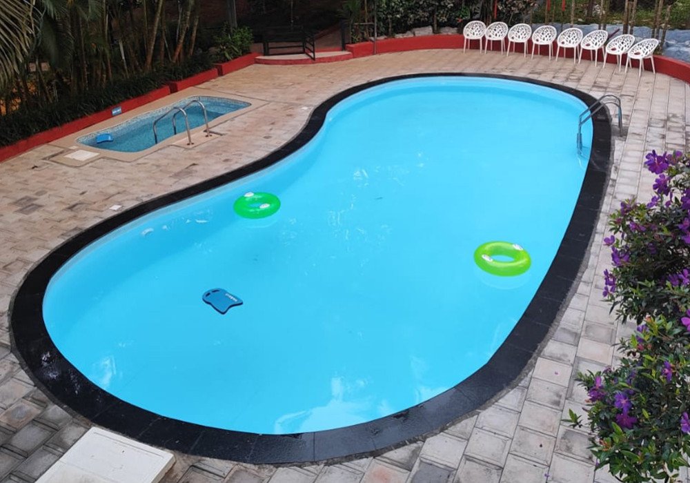 Swimming pool at Karapuzha Village Resort Wayanad